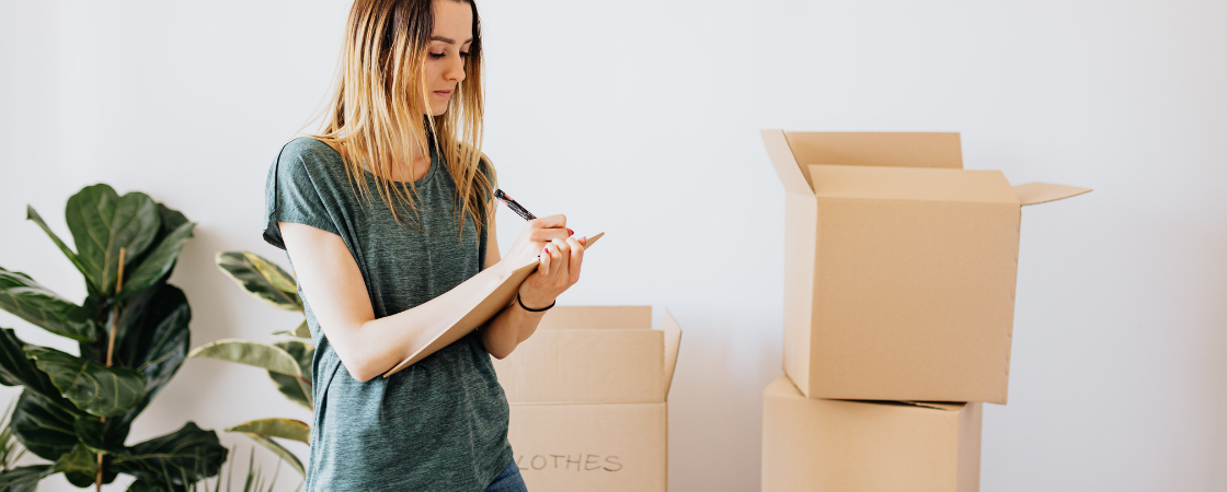 woman making a list selling a house